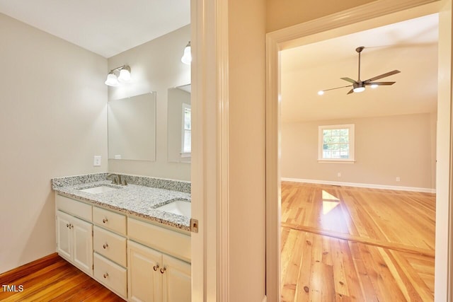 369 Historic Village Dr, Roxboro, NC 27574 - bathroom featuring wood finished floors, double vanity, and ceiling fan