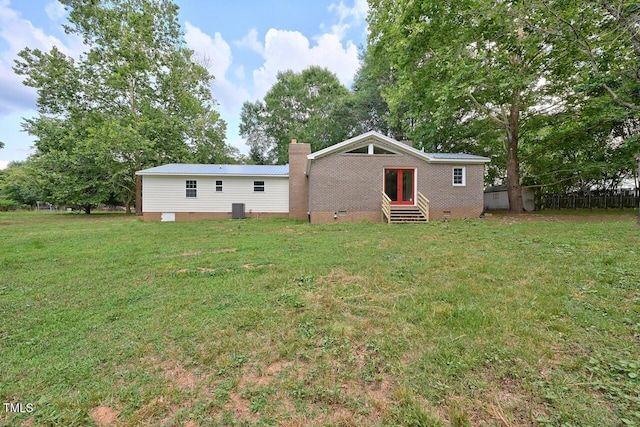 369 Historic Village Dr, Roxboro, NC 27574 - back of house with entry steps, crawl space, a lawn, and a chimney