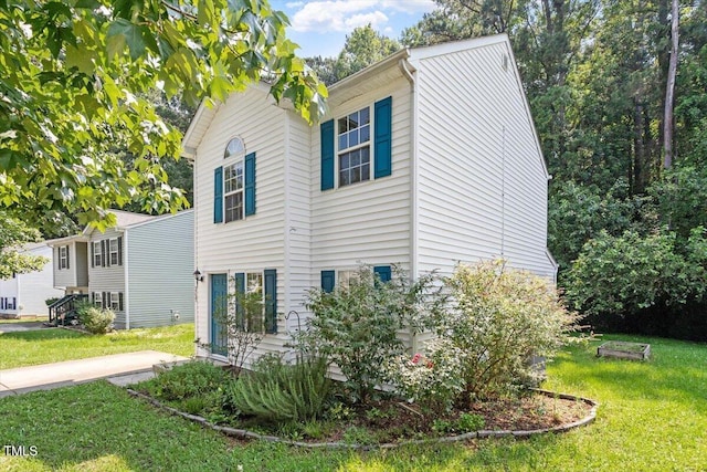 2733 Midway Park Ct, Raleigh, NC 27610 - view of side of property with a yard