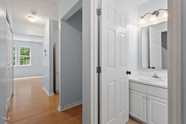 2733 Midway Park Ct, Raleigh, NC 27610 - bathroom featuring vanity and wood finished floors