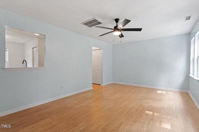 2733 Midway Park Ct, Raleigh, NC 27610 - spare room featuring a ceiling fan and light wood-style flooring