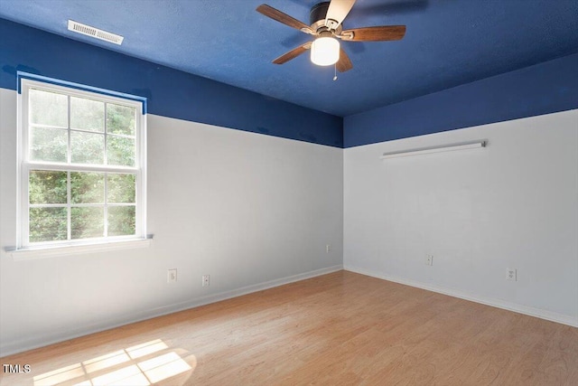 2733 Midway Park Ct, Raleigh, NC 27610 - spare room featuring wood finished floors, healthy amount of natural light, and ceiling fan