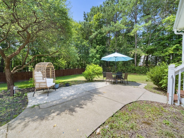 20 Little River Ct, Youngsville, NC 27596 - fenced backyard with a patio area