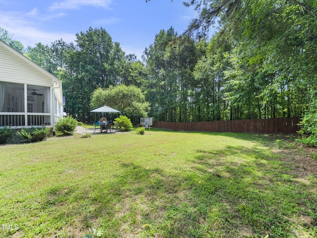 20 Little River Ct, Youngsville, NC 27596 - view of yard with a sunroom, a ceiling fan, and a patio area