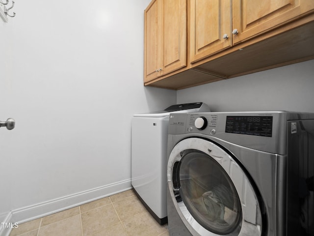 20 Little River Ct, Youngsville, NC 27596 - laundry room with cabinet space, washer and clothes dryer, and light tile patterned flooring