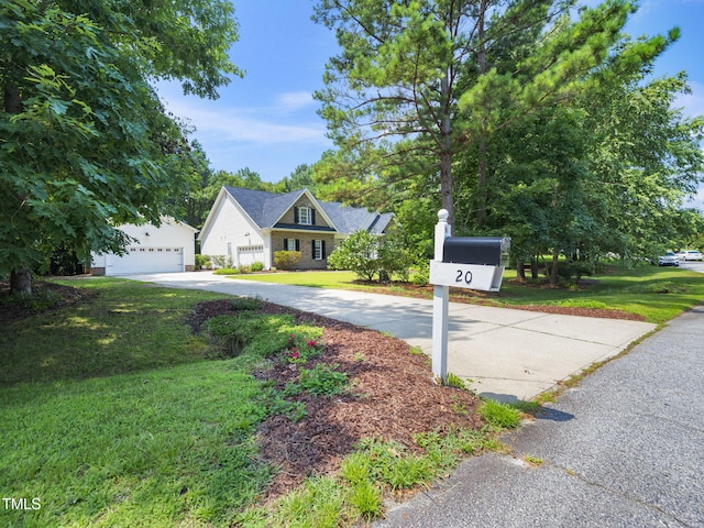 20 Little River Ct, Youngsville, NC 27596 - view of front of home with a front lawn and a detached garage