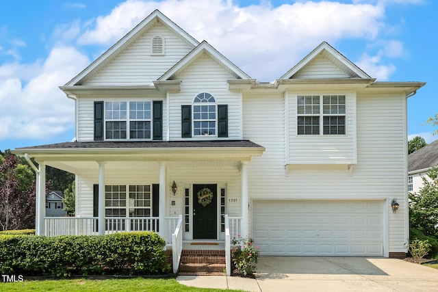 1201 Woodlands Creek Way, Apex, NC 27502 - view of front of home with a porch, concrete driveway, and an attached garage