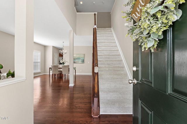 1201 Woodlands Creek Way, Apex, NC 27502 - entryway with dark wood-style flooring, stairs, and a chandelier