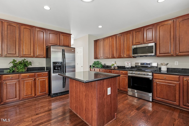 1201 Woodlands Creek Way, Apex, NC 27502 - kitchen featuring stainless steel appliances, a center island, recessed lighting, dark wood finished floors, and brown cabinets