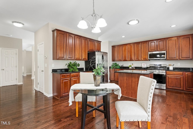 1201 Woodlands Creek Way, Apex, NC 27502 - kitchen with stainless steel appliances, dark countertops, a chandelier, recessed lighting, and hanging light fixtures