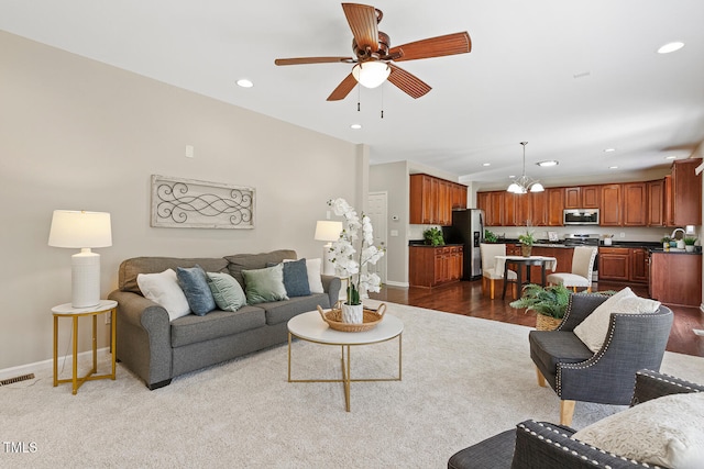 1201 Woodlands Creek Way, Apex, NC 27502 - living area featuring ceiling fan, recessed lighting, a chandelier, and wood finished floors