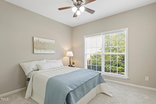 1201 Woodlands Creek Way, Apex, NC 27502 - carpeted bedroom with multiple windows and ceiling fan