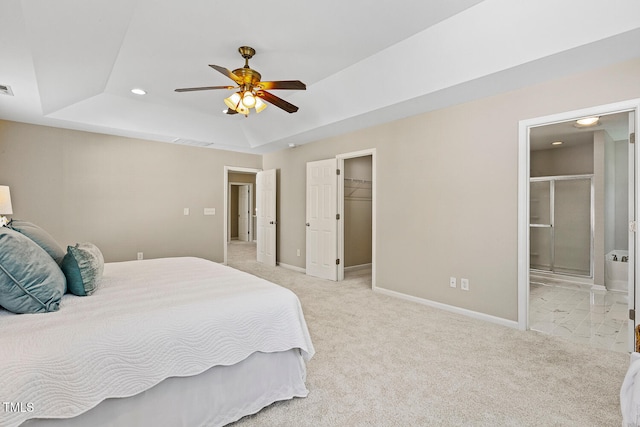 1201 Woodlands Creek Way, Apex, NC 27502 - bedroom with a tray ceiling, recessed lighting, light colored carpet, connected bathroom, and a walk in closet