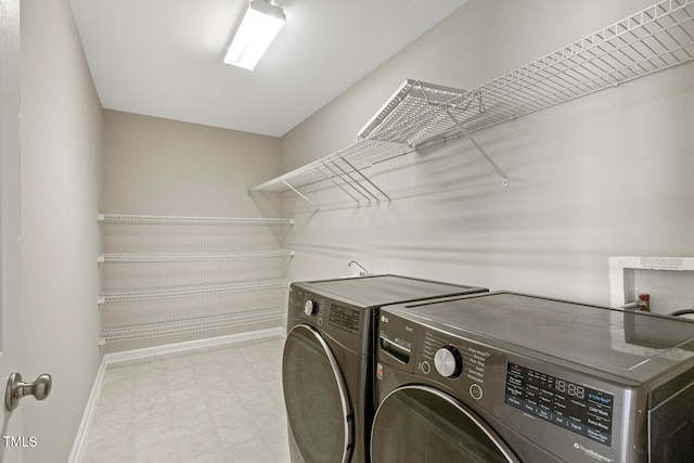 1201 Woodlands Creek Way, Apex, NC 27502 - laundry area featuring washer and dryer and tile patterned floors