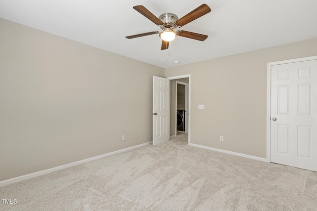1201 Woodlands Creek Way, Apex, NC 27502 - unfurnished bedroom featuring washer / clothes dryer, light colored carpet, and ceiling fan