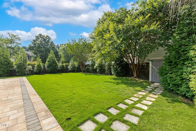 1201 Woodlands Creek Way, Apex, NC 27502 - fenced backyard featuring a storage shed