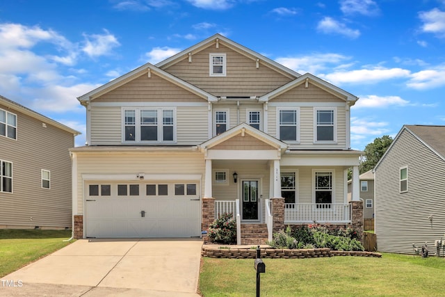 2714 Magnolia Tree Ln, Durham, NC 27703 - craftsman-style home featuring an attached garage, a porch, a front lawn, and driveway