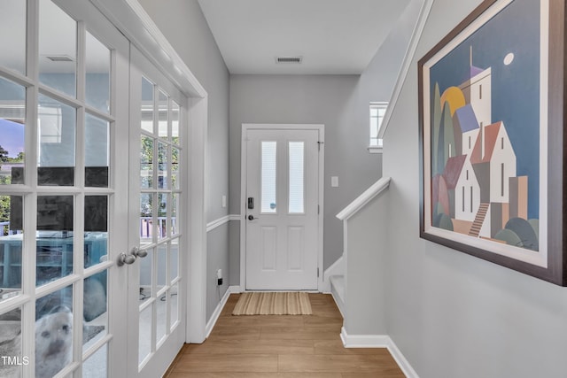 2714 Magnolia Tree Ln, Durham, NC 27703 - entrance foyer featuring wood finished floors, french doors, and stairs