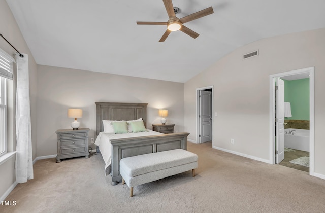 2714 Magnolia Tree Ln, Durham, NC 27703 - bedroom featuring vaulted ceiling, light carpet, ensuite bath, and a ceiling fan