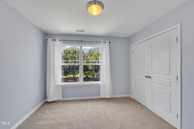 2714 Magnolia Tree Ln, Durham, NC 27703 - unfurnished bedroom with carpet floors and a closet