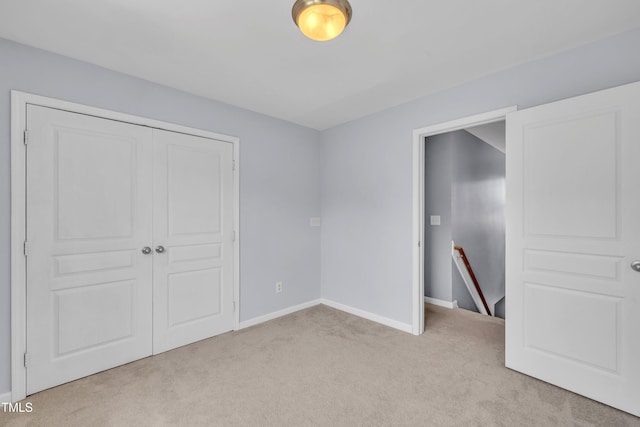 2714 Magnolia Tree Ln, Durham, NC 27703 - unfurnished bedroom featuring light carpet and a closet
