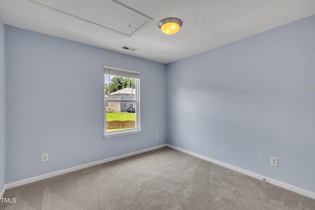 2714 Magnolia Tree Ln, Durham, NC 27703 - carpeted empty room featuring attic access and baseboards