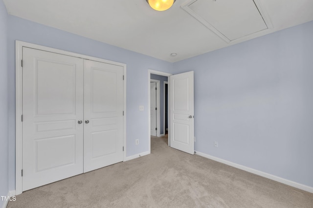 2714 Magnolia Tree Ln, Durham, NC 27703 - unfurnished bedroom featuring attic access, carpet, and a closet