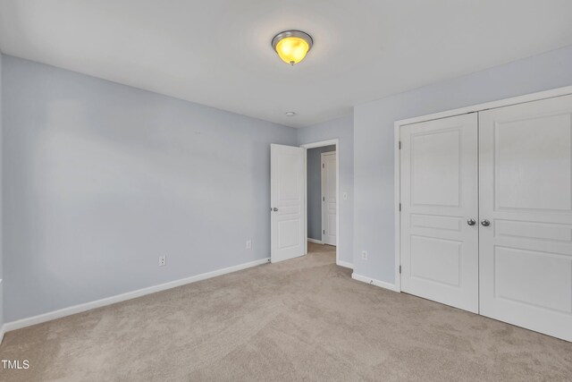 2714 Magnolia Tree Ln, Durham, NC 27703 - unfurnished bedroom featuring carpet flooring and a closet