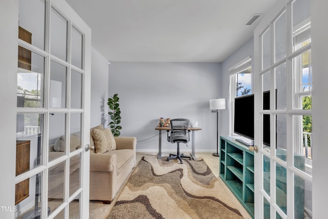 2714 Magnolia Tree Ln, Durham, NC 27703 - sitting room with french doors, an office area, and carpet floors
