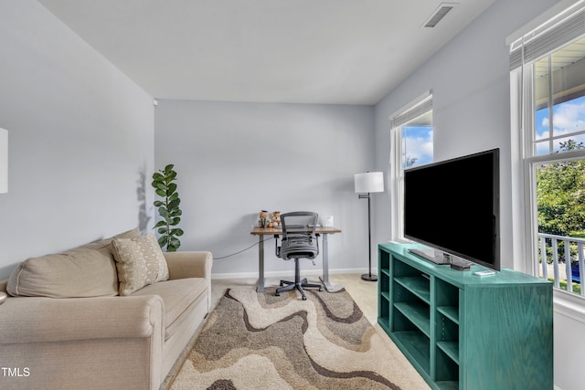 2714 Magnolia Tree Ln, Durham, NC 27703 - carpeted living area featuring baseboards