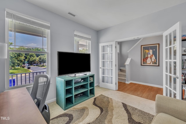 2714 Magnolia Tree Ln, Durham, NC 27703 - carpeted office space featuring french doors and baseboards