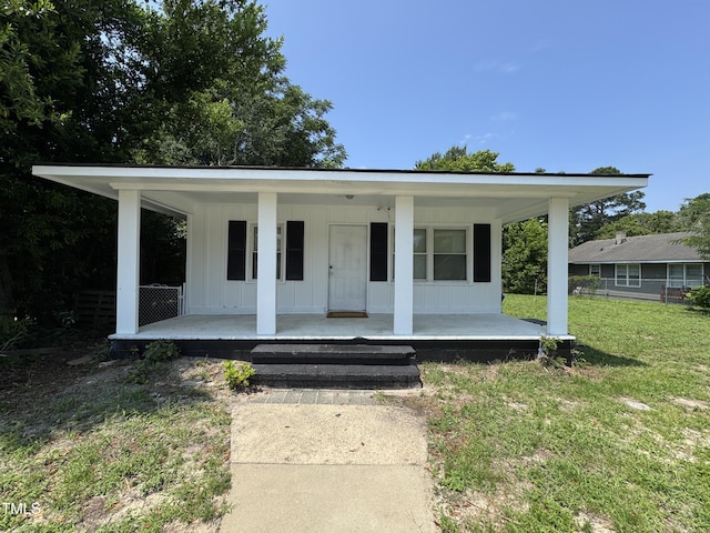 122 S 5th St, Spring Lake, NC 28390 - view of front of house featuring covered porch and board and batten siding