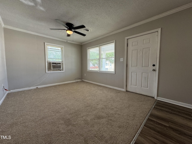 122 S 5th St, Spring Lake, NC 28390 - spare room featuring cooling unit, crown molding, ceiling fan, dark wood finished floors, and a textured ceiling