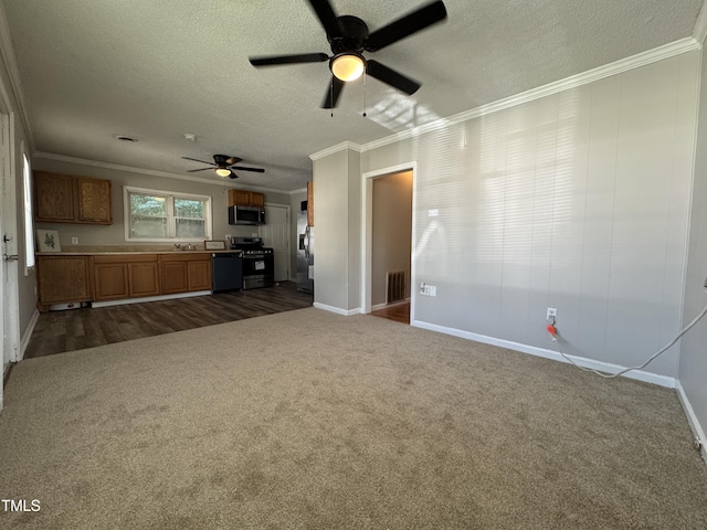 122 S 5th St, Spring Lake, NC 28390 - unfurnished living room featuring a ceiling fan, crown molding, a textured ceiling, dark colored carpet, and dark wood-style flooring
