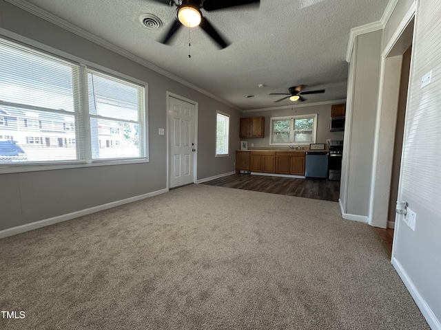 122 S 5th St, Spring Lake, NC 28390 - unfurnished living room with a ceiling fan, dark colored carpet, ornamental molding, and a textured ceiling