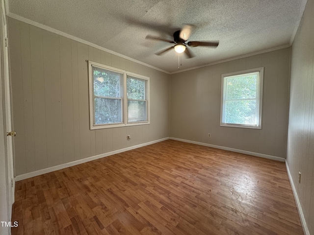 122 S 5th St, Spring Lake, NC 28390 - spare room with wood finished floors, a ceiling fan, ornamental molding, and a textured ceiling