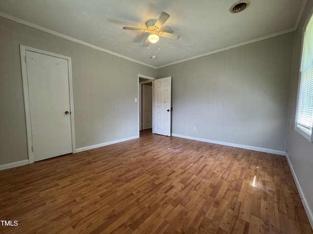122 S 5th St, Spring Lake, NC 28390 - empty room featuring wood finished floors, ceiling fan, and ornamental molding