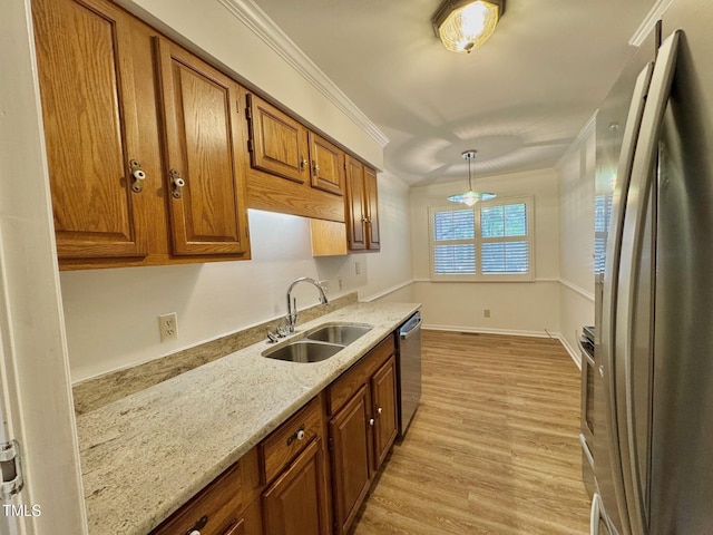2535 Fairway Dr, Henderson, NC 27536 - kitchen with appliances with stainless steel finishes, brown cabinets, crown molding, light wood-style floors, and light stone counters