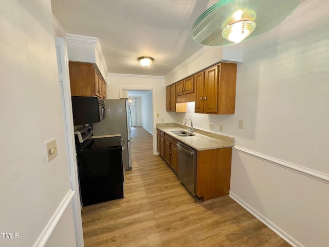 2535 Fairway Dr, Henderson, NC 27536 - kitchen with stainless steel appliances, brown cabinetry, light countertops, light wood-style floors, and ornamental molding