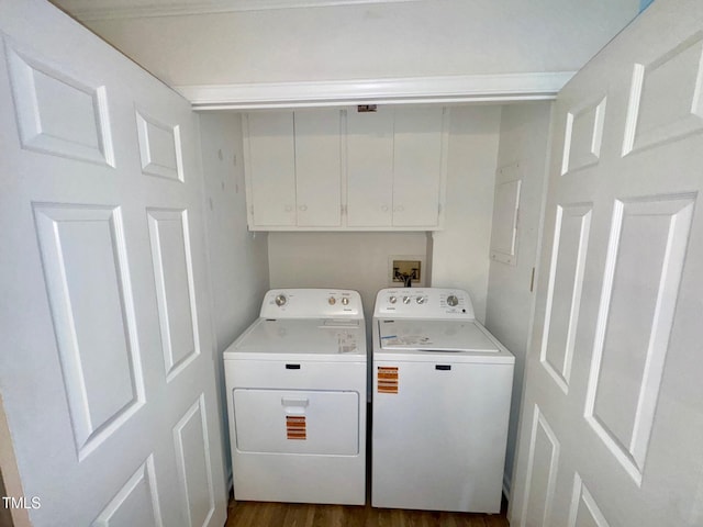 2535 Fairway Dr, Henderson, NC 27536 - laundry room with cabinet space, washing machine and clothes dryer, and dark wood-style flooring