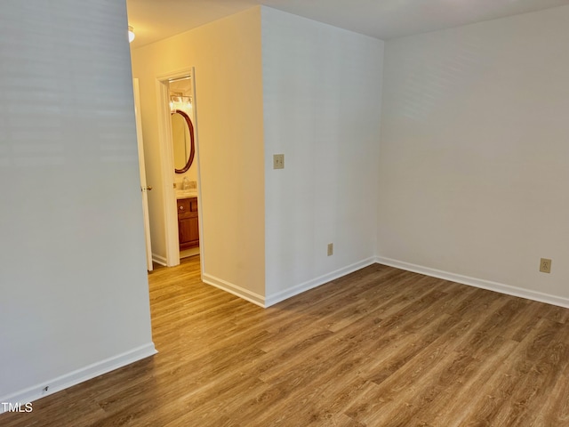2535 Fairway Dr, Henderson, NC 27536 - spare room with wood finished floors and a sink