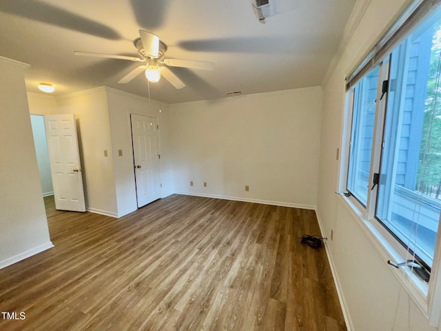 2535 Fairway Dr, Henderson, NC 27536 - unfurnished room featuring ceiling fan, wood finished floors, and crown molding