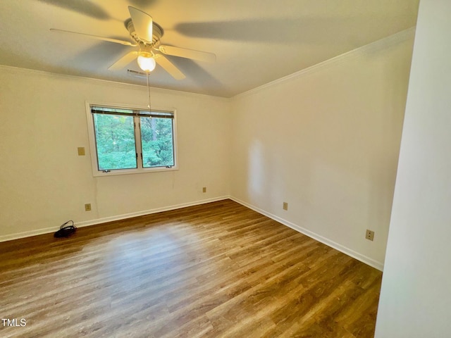 2535 Fairway Dr, Henderson, NC 27536 - empty room with wood finished floors, crown molding, and a ceiling fan