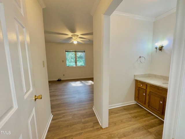 2535 Fairway Dr, Henderson, NC 27536 - bathroom featuring wood finished floors, vanity, crown molding, and a ceiling fan