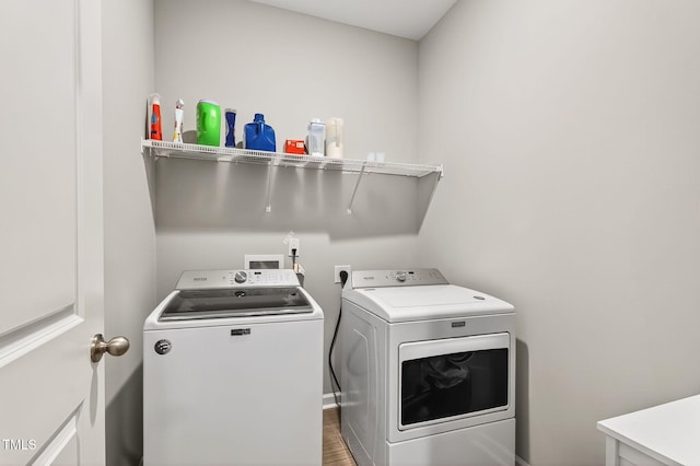 611 Laurel Lake Rd, Salemburg, NC 28385 - laundry room featuring separate washer and dryer and wood finished floors