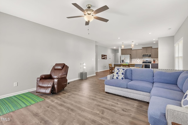 611 Laurel Lake Rd, Salemburg, NC 28385 - living room with a ceiling fan, light wood finished floors, and recessed lighting