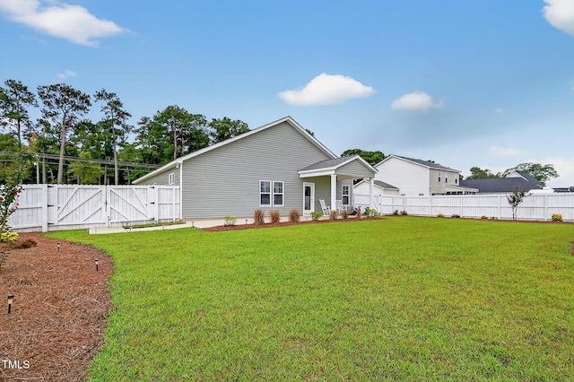 611 Laurel Lake Rd, Salemburg, NC 28385 - rear view of property featuring a gate and a fenced backyard