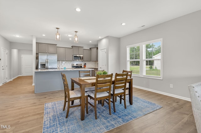 611 Laurel Lake Rd, Salemburg, NC 28385 - dining room with light wood-style floors and recessed lighting