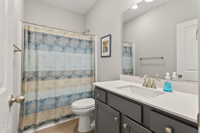 611 Laurel Lake Rd, Salemburg, NC 28385 - full bath featuring vanity, wood finished floors, and curtained shower