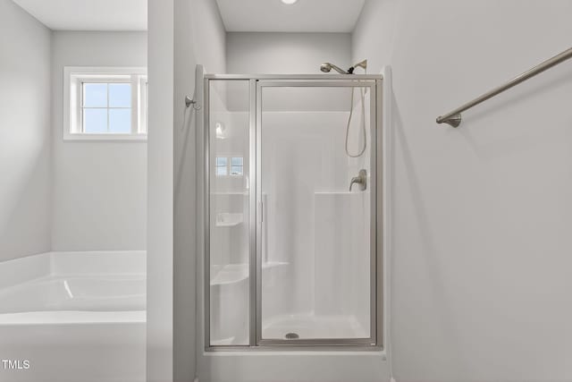 611 Laurel Lake Rd, Salemburg, NC 28385 - full bathroom featuring a stall shower and a garden tub